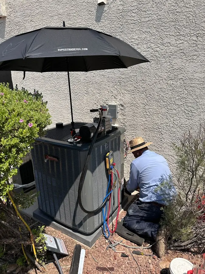 HVAC technician performing outdoor AC maintenance in Waveland